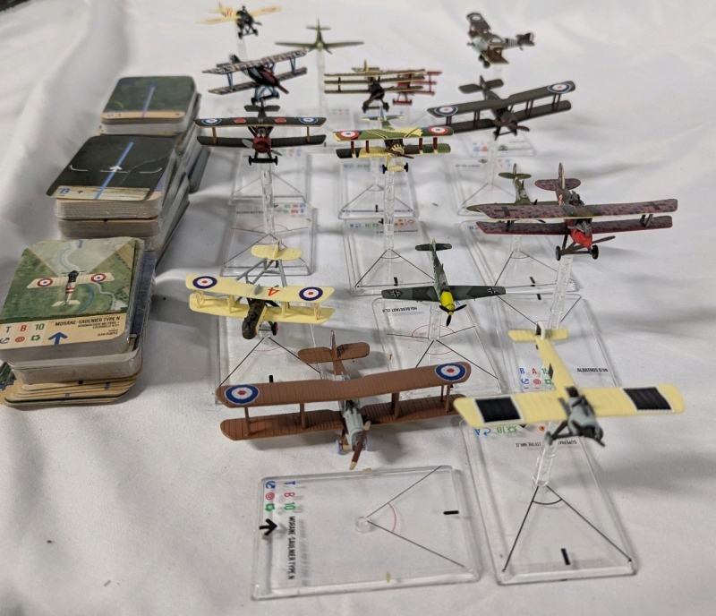 15 Wings of War/Wings of Glory Models with Bases & Info Cards w/Rules , Maps and Poster. Models not Checked for matching bases or cards.