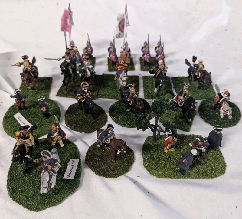 32 Hand-painted Lead and Plastic Miniatures. Includes Calvery, Fusiliers and Officers. Soldiers Stand 1.5" Tall on Flocked Bases.