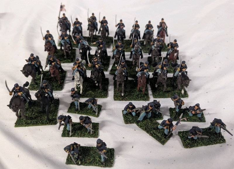 40 Hand-painted Civil War Miniature Cavalry and Foot Soldiers. Primarily Painted as New York. Cavalry Stands 2" Tall on Flocked Bases.