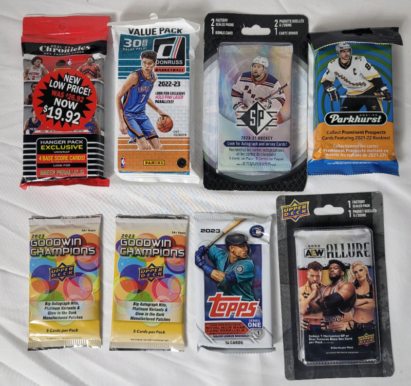 Eight (8) Sports Trading Card Sealed Packs . All Sports , Hockey , Baseball , Basketball & Wrestling .