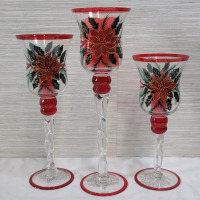 Three (3) Festive Christmas Glass Candle Holders with Battery Candles . Measures 11.5" to 15.5" tall . Candles require batteries