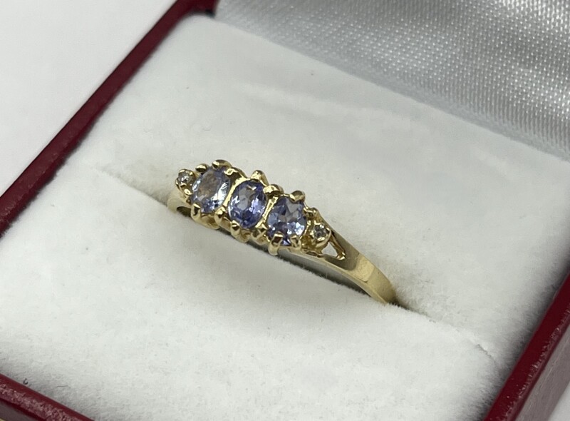 14KT Yellow Gold Natural Tanzanite (0.50ct) and Diamond (0.01ct) Ring, Size 8, W/A $1475.00. Tanzanite is the birthstone for December.