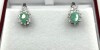 Sterling Silver Natural Emerald and CZ Earrings, Retail $450.00. Emerald is the birthstone for May.