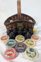 Wicker Basket Full of Candles, Wax Potpourri & Essential Oils. 7 Candles, 8 Potpurris and 1 Bottle of Essential Oils. Basket measures 8" Tall.