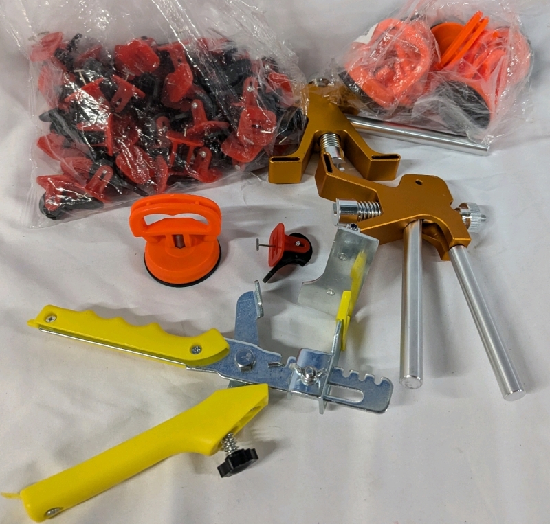Assorted Tool Lot - 6 Car Dent Pulling Tools, 2 Car Dent Removal tools, 1 Tile Levelling Plier, and 20+ Tile Levelling System Devices.