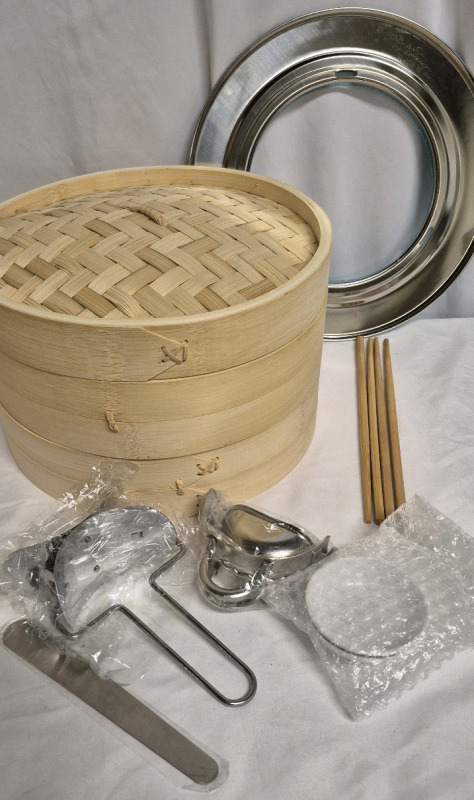 New Tessco 2 Tier Bamboo Steamer Basket Set 10" Diameter Includes Stainless Steel Steamer Ring, Dumpling Maker Mold and Cutter, Meat Spoon, 2 Pairs Bamboo Chopsticks & 2 Pcs Sauce Dish