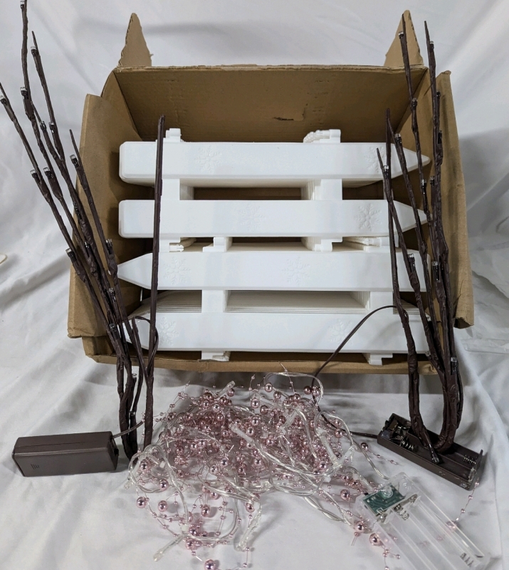 New Holiday Decor Lot -25+ Sections of Fence. 2 Light up Branches and Light Strand with Pink Beads. Branches are Missing one of Two battery Covers. All Lights Working. Fence Sections 11" Tall.