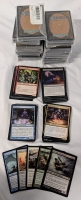 13 Magic The Gathering Trading Card Game Built Card Repacks. 2 Opened, Each Appears To Contain 5 Rares, 20 Uncommons and 25 Commons. Hand Count Not Performed. Sets as Far Back as the Ice Age Block Present. Some Commander Cards Also Seen.