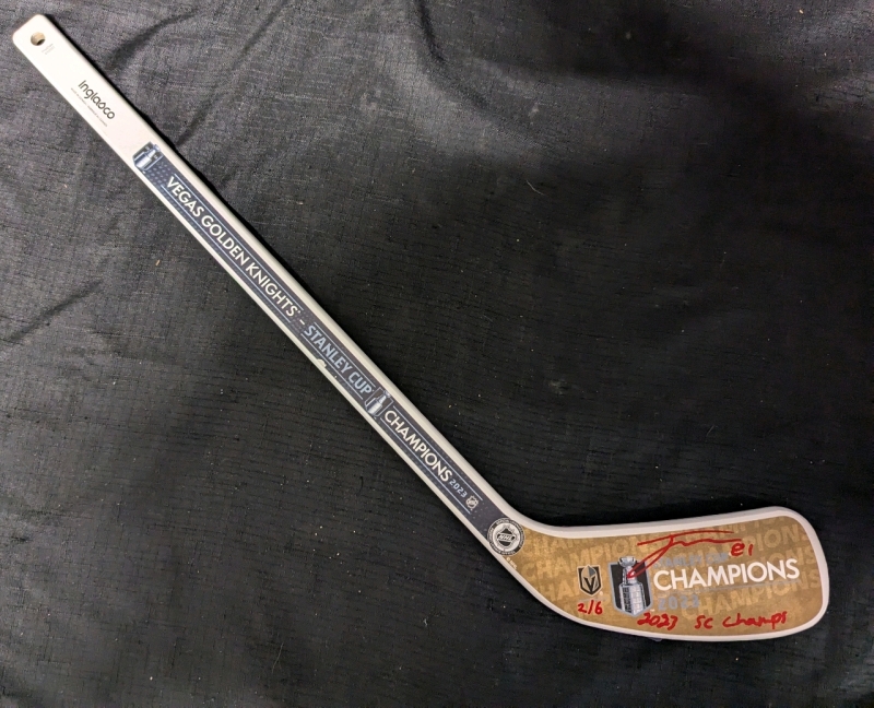 Signed Inglasco Vegas Golden Knights 2023 Stanley Cup Champions Mini Hockey Stick. Singed by Jonathan Marchessault. Authenticon Stamp present. 2/6. Some Scuffs Present Due to Shipping.