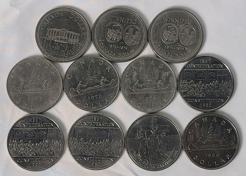 1973 - 1986 Canadian One Dollar Coins . 1973 , 1974 ×2 , 1975 , 1976 , 1979 , 1982 ×3 , 1984 & 1986 . Eleven (11) Coins