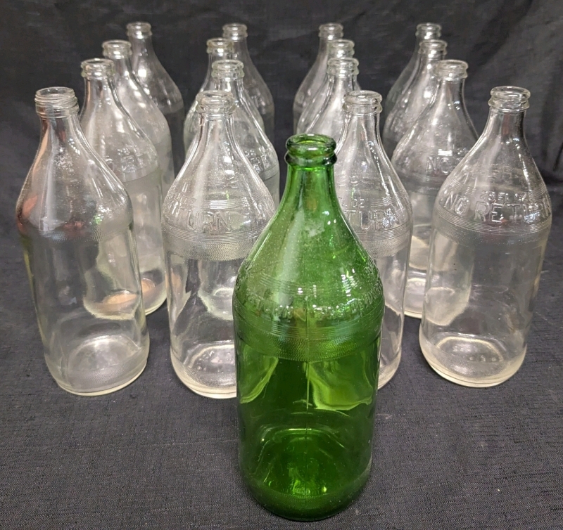 17 Vintage Glass Bottles Between 26-30oz in Size. 15 Bottle are the Same marked with "No Return" (28oz). 1 Green Bottle Marked "No Deposit, No Return" (30oz.) and last bottle Marked "Do not Litter or Refill" (26oz)