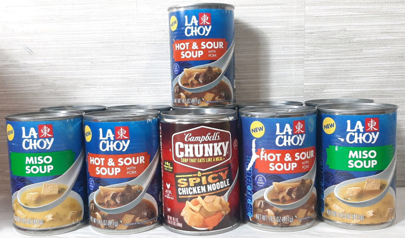 11 New Cans of Various Soup Cans, Including Campbell's Chunky Spicy Chicken Noodle, La Choy Miso Soup & La Choy Hot & Sour Soup with Pork - La Choy Cans are 411g, Chunky is 458g, La Choy Best Before November 2025 & Campbells Expires February 2026