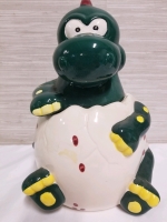 Adorable baby Dinosaur in an egg cookie jar