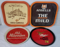 Four (4) Vintage Beer Trays . Measures 12.5" & 10 1/4" across . Miller & Old Milwaukee have Nail hole near top