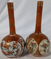 2 Kutani Style Vases. One Vase has No Chips, Cracks or Crazing Noted. The Second has chips, repaired Cracks, Crazing and Faded Colours. Both are approximately 9.5" Tall.