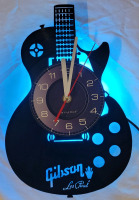 New - Gibson Les Paul Vinyl LP Wall Clock w/LED Back-Light & Remote . Measures 12" . Requires One (1) AA Battery (not included)
