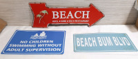 3 New Beach Themed Metal Signs (Arrow is 18" Long, 6&frac12;" Tall. "No Children" Is 12" Wide, 8" Tall. "Beach Bum Blvd" is 12" Wide, 6" Tall)