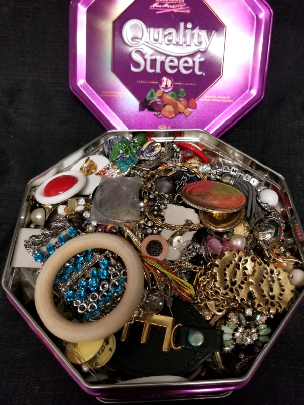 Chocolate tin full of jewelry