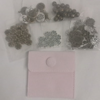 New | Over 30 Pcs Assorted Charms & Mini Jewelry Bag in the Color Pink