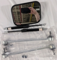 New Auto Part Lot. 2 Front Stabilizer Links (Model Unknown). 2 11" Gas Prop Strip. And one Rear View Mirror 7" across.