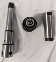 3 New Tools. 1 Drill Chuck Adaptor (6.75" long), 1 1/16"-1/2" Drill Chuck and a Morse Taper Drill Sleeve.