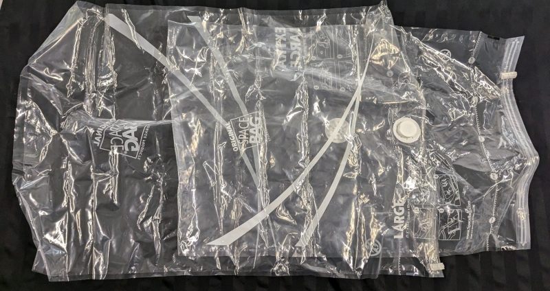 2 New Space Bag Vacuum Seal Bags. See photos for sizes.