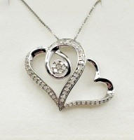 Sterling Silver Natural Diamond (0.50ct) Double Heart Shape Pendant with Sterling Silver Chain, W/A $1250.00. Diamond is the birthstone for April.