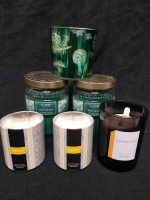 LOt of 6 new candles largest is 18 oz scents include Teakwood, cedar ash, snowcapped pine and silver spruce
