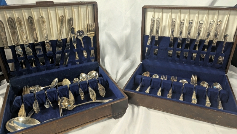 2 Agents of Cutlery. Larger Box(14.5" by 11" by 4") is Stainless Steel, Smaller (14.5, by 10.5 by 3.25") is Silver Plate.