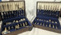 2 Agents of Cutlery. Larger Box(14.5" by 11" by 4") is Stainless Steel, Smaller (14.5, by 10.5 by 3.25") is Silver Plate.
