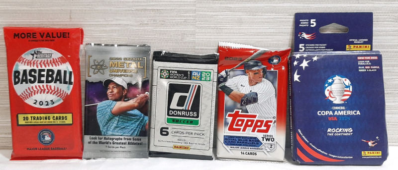 Lot of Sports Trading Cards, Including Topps Heritage 2023 Major League Baseball 20 Pack, Skybox 2022 Metal Universe Champions 7 Card Pack, Panini 2023 DonRuss FIFA's Women's World Cup Soccer 6 Pack, Topps 2023 Major League Baseball Series Two 14 Pack & P