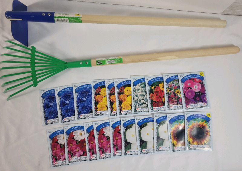 New - TrueLiving Garden Hoe & Rake plus 20 Garden Flower Seed Packs (dated sell By 12/24) . Rakes measure 24" & 29" long