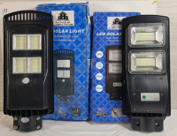 Two (2) Home & Lighting Outdoor LED Solar Lights . 14000LM (140watts) & 6000LM (90watts)