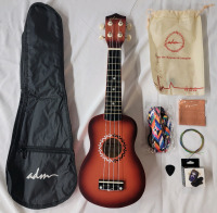 New - ADM Ukulele w/Travel Bag & Accessories . Model # JU110N-21-SBR