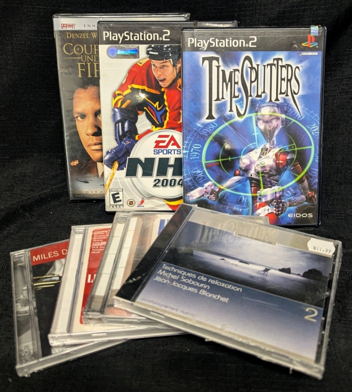 7 Media Disks - 4 CDs - 2 PS2 Games Timesplitters - NHL 2004 - 1 DVD Courage Under Fire