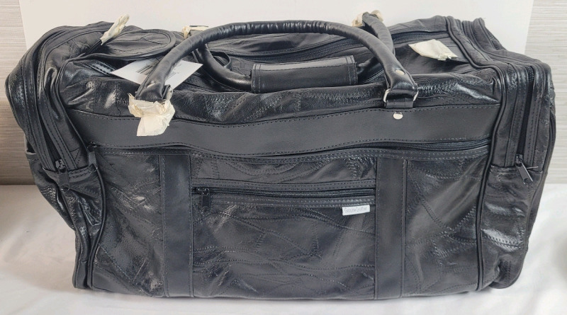 New - Embassy Leather Travel Bag . Measures 21"&times;11"&times;9"