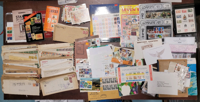 World Postage Stamp Lot . This is a Large Postage Stamp Lot and Includes 1st Day Issues , Stamp Info Books , Stamped Envelopes , Stamp Books , Post Cards plus more +++