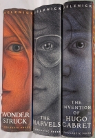 3 Hardcover Books by Brian Selznick. "The Invention of Hugo Cabret", "The Marvel's", and Wonder struck". 8.5" Tall.
