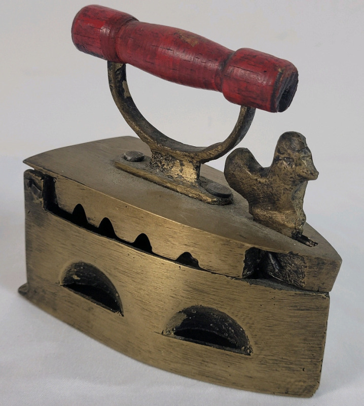 Antique Brass Coal Iron . Measures 4" long