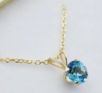 10KT Yellow Gold Natural Blue Topaz (0.8ct) Round Pendant With Gold Plated Sterling Silver Chain, Retail $400.00.