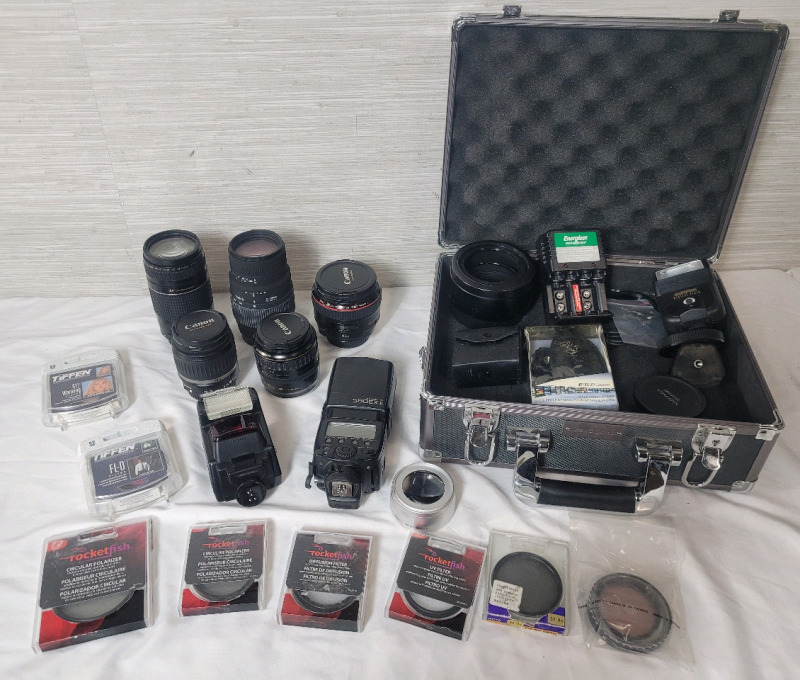 Camera Lenses & Camera Accessories Lot . Canon & Sigma Lenses . Warming, UV, Diffusion Glass Filters . Canon and Nikon Flashes plus Hardshell Camera Case . All Lenses appear scratch free and no apparent mold