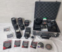 Camera Lenses & Camera Accessories Lot . Canon & Sigma Lenses . Warming, UV, Diffusion Glass Filters . Canon and Nikon Flashes plus Hardshell Camera Case . All Lenses appear scratch free and no apparent mold