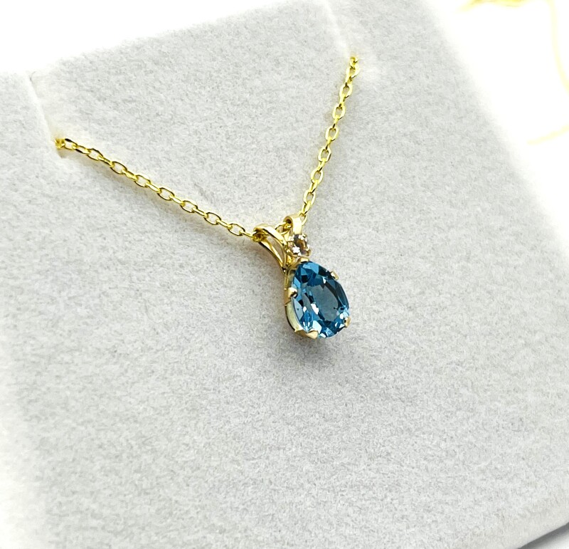 10KT Yellow Gold Natural Blue Topaz Pendant with Gold Plated Sterling Silver Chain, Retail $350.00.
