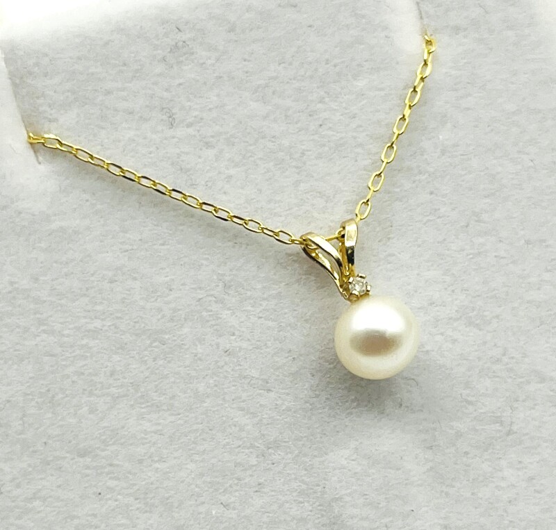 14KT Yellow Gold Pearl and Diamond With Gold Plated Sterling Silver Chain, Retail $450.00.