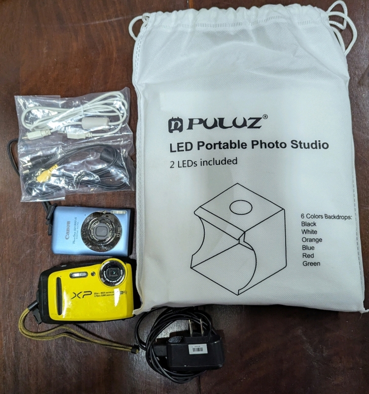 Digital Camera Lot. 2 Cameras and 1 LED Portable Photo Studio.