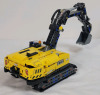 LEGO Technic Heavy-Duty Excavator Build Set , # 42121 . Assembled , 565 pcs. Appears Complete , Missing 4 red pylons . Some dust from display . Measures 12"&times;4.5" - 3