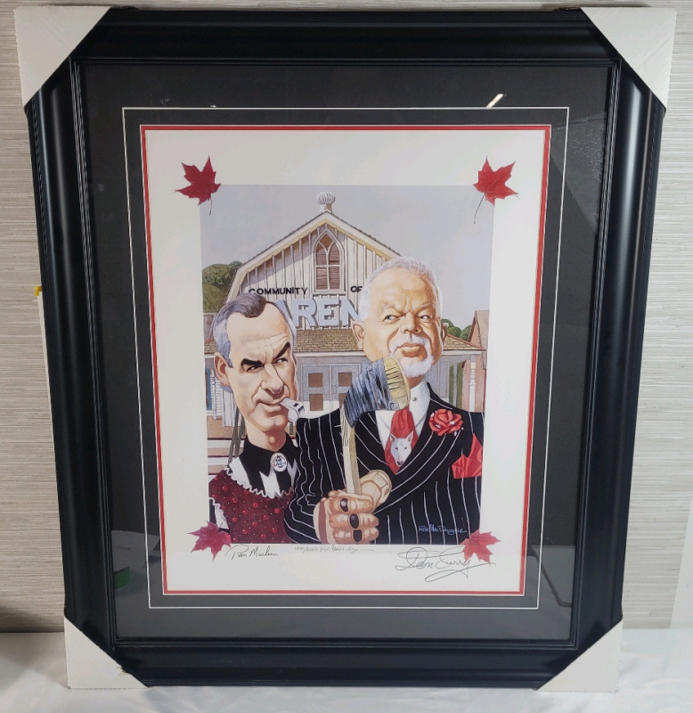 Signed & Numbered Print - Don Cherry & Ron MacLean " Canadian Gothic " by Canadian Artist Rob McDougall , Signed & Numbered Framed Print plus Mpeg DVD . Signed by Don Cherry , Ron MacLean & Rob McDougall . Measures 28.5"&times;35" .