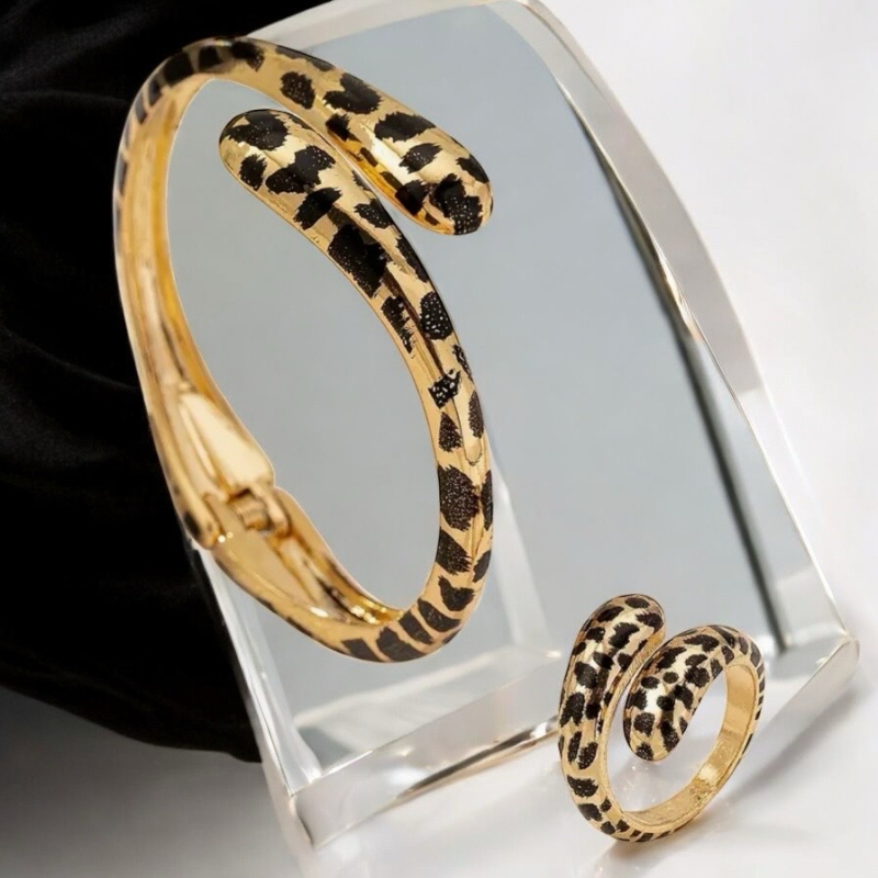 2 Piece Set Leopard Print Hinged Bracelet and Ring Set in Retro Style Print Approximately 2.25 Inch Diameter 1 inch opens Ring size 6