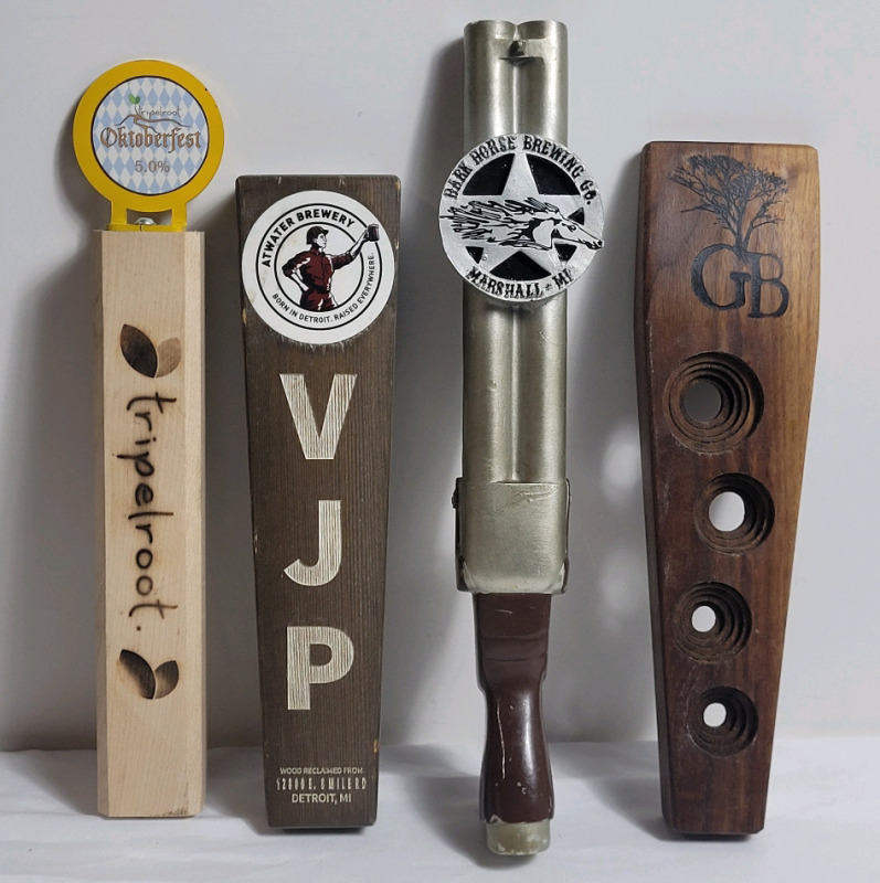 Four (4) Bar Beer Taps . Tripleroot , Atwater Brewing , Dark Horse Brewing & GB Brewing . Measures 11" to 13.5" tall