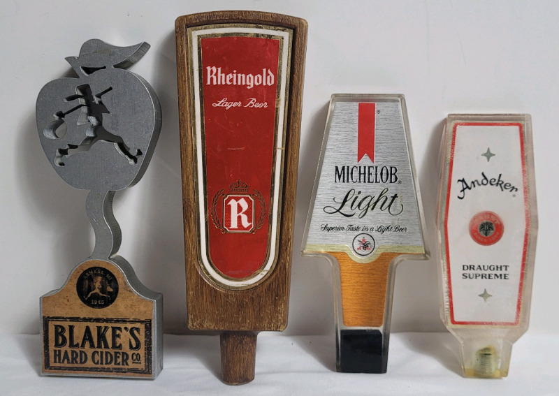 Four (4) Bar Beer Taps . Blake's Hard Cider Co. , Rheingold , Michelob Light & Andeker . Measures 6" to 8.5" tall